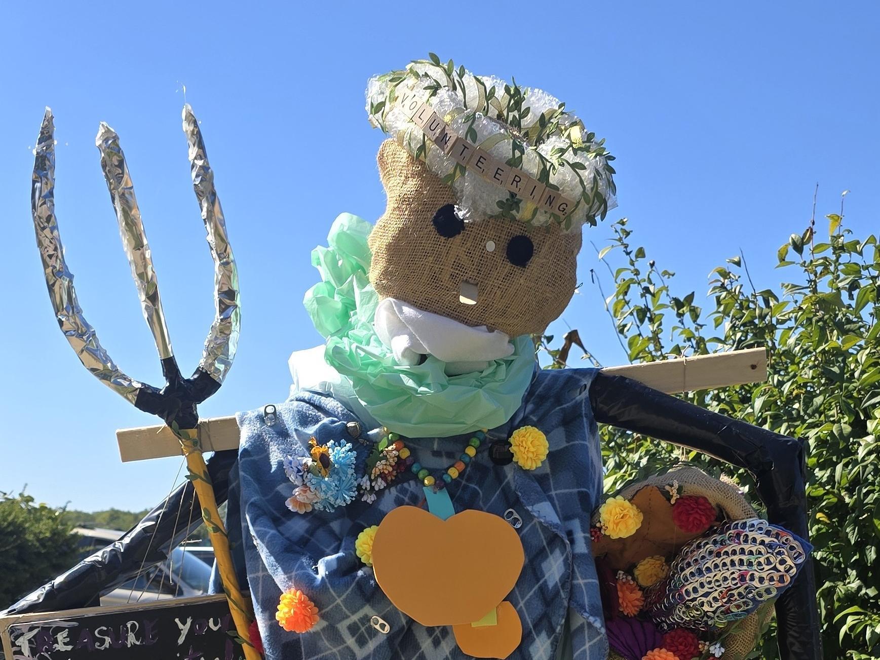 Scarecrow holding a trident